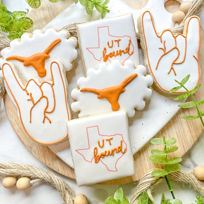Custom UT Longhorn-themed graduation cookies featuring the Longhorn logo and celebratory "Hook 'Em" messages, fully customizable.
