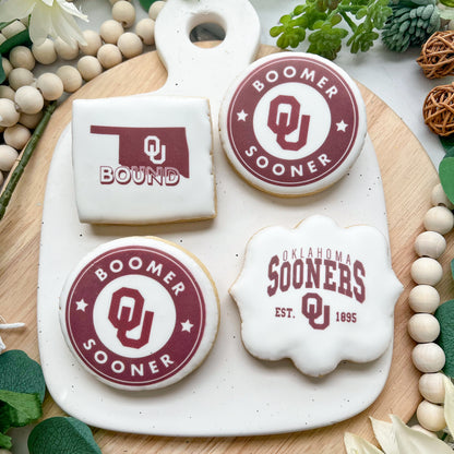 Custom Oklahoma Sooners graduation cookies featuring the OU logo and celebratory plaques, perfect for graduation events, fully customizable.

