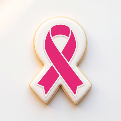 A ribbon-shaped sugar cookie with a solid white icing base and a bold hot pink awareness ribbon printed on top with a clean white border frame.