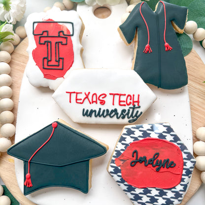 Texas Tech University graduation-themed cookies, featuring grad caps, the Texas Tech logo, and personalized plaques in red, black, and white.
