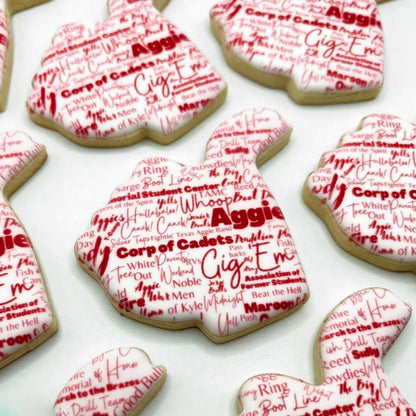 Custom Texas A&M Aggie Thumb graduation cookies featuring words and phrases representing the Aggie spirit, fully customizable.

